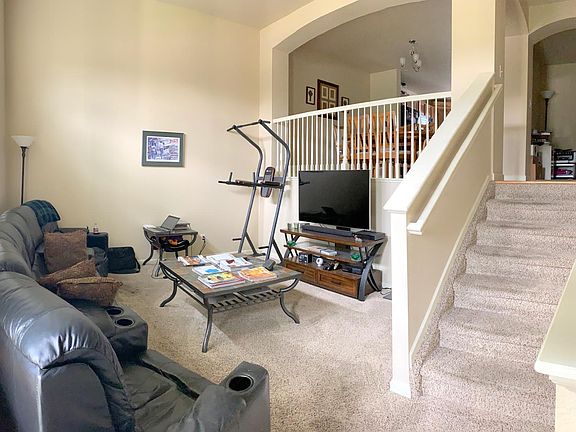 Living room looking up to towards the office and dining area