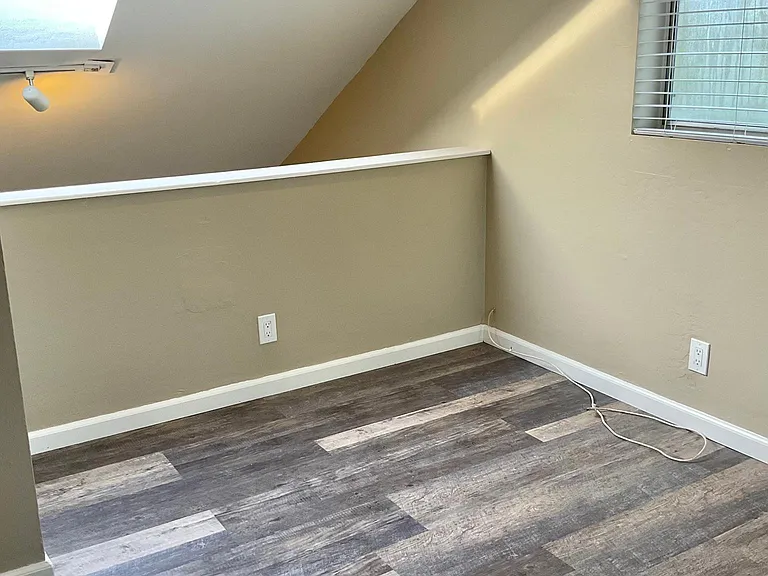 Bedroom with vaulted ceilings