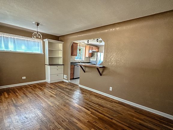 Main living area with built-in cabinets bar counter