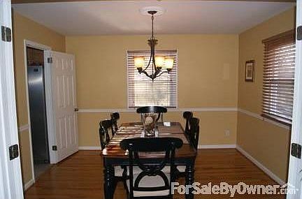 Dining Room : Chair molding, fresh painted, new light fixture, wood blinds, new hardwood flrs