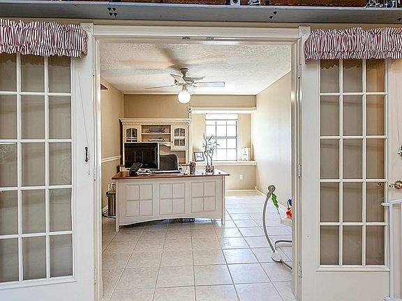 INVITING STUDY WITH FRENCH DOORS OR OPTINAL FOURTH BEDROOM ~