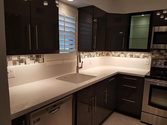 See the glass door cabinets for display items that accent the ambience of the kitchen.