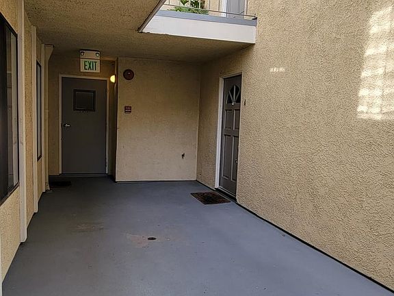 Front door close to entrance to staircase to garage.