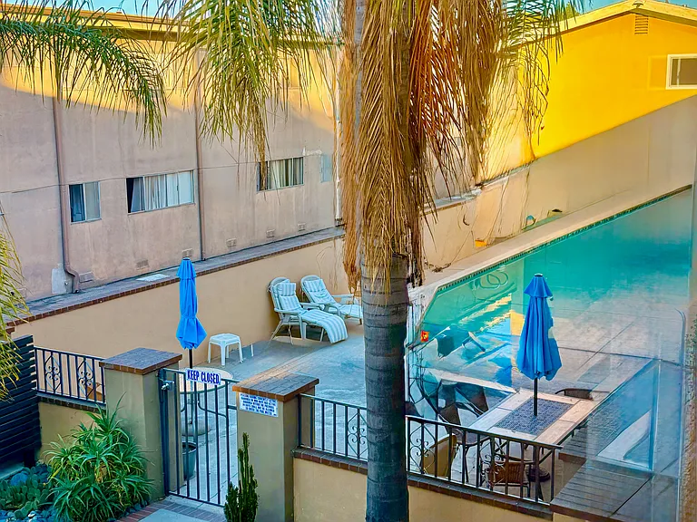 View of pool & center courtyard from bedroom.