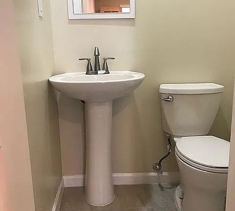 Common area includes a shared half bath/powder room.
