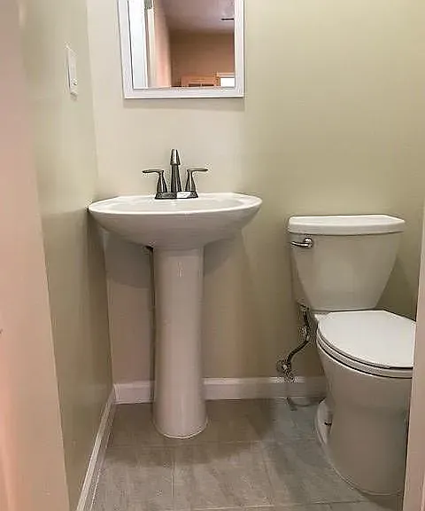 Common area includes a shared half bath/powder room.