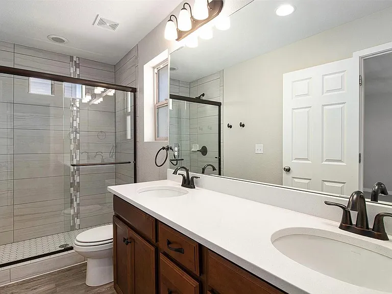 2 Large bathrooms upstairs. One is on suite with the primary bedroom.