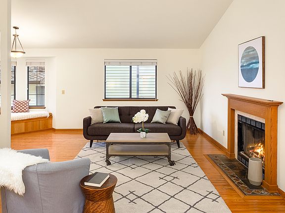 Custom built mantel accentuates this cozy gas fireplace.