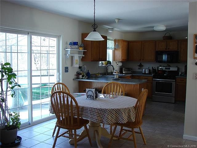 Kitchen with slider to expa...