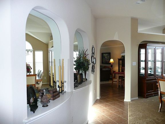 Dramatic Entryway with Two Art Niches and Curved Wall
