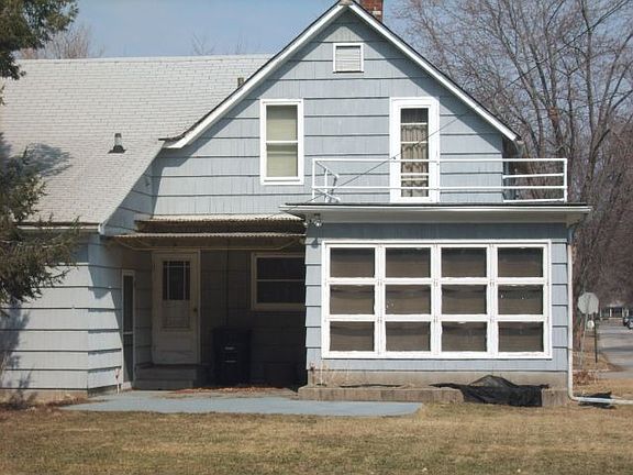 Rear 3 season sun room and covered patio.