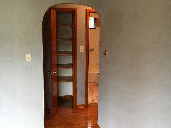 Living room looking into linen closet 