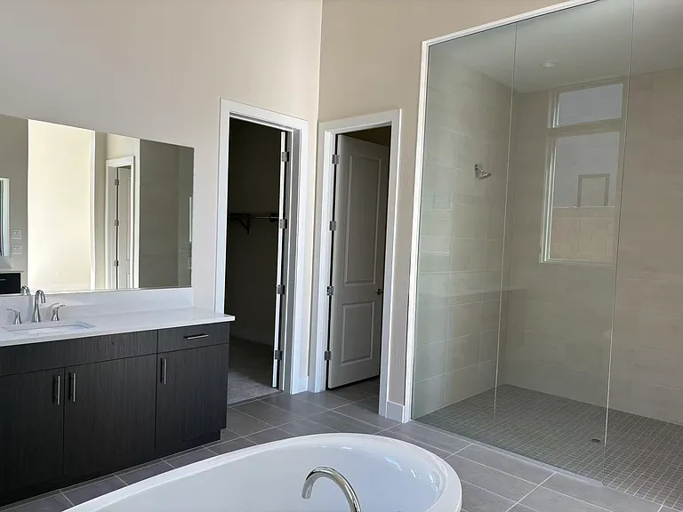 Master washroom with shower and tub