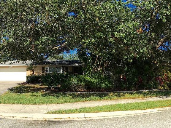 Front with 2.5 car garage, large side gate.
