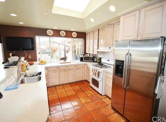Enlarged and remodeled kitchen with huge skylight above