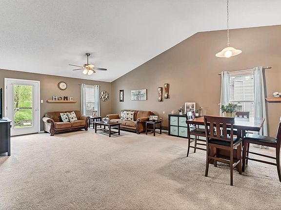 Another great view of this Vaulted Great Room with Eat-In Dining Room.
