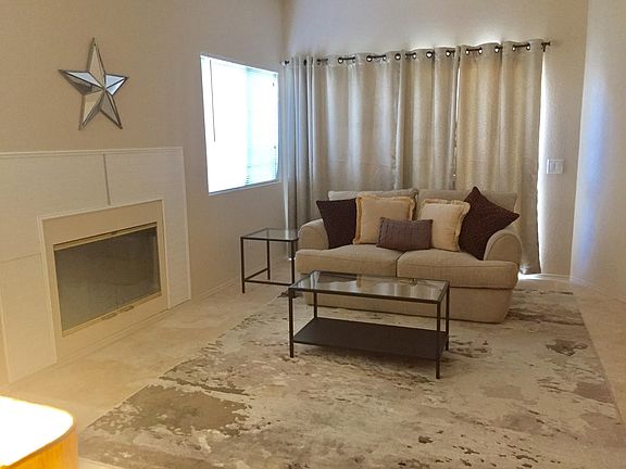natural travertine floors throughout the unit 