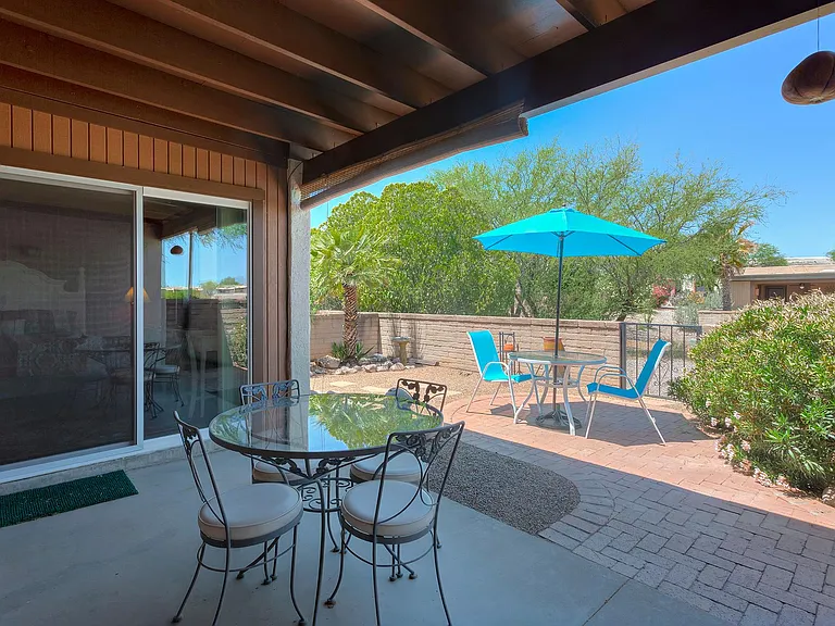 Shade and sun option for back patio. Gate opens to common area.