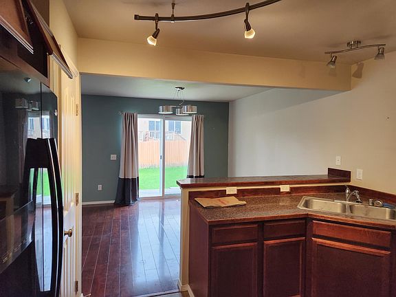 View from kitchen to dining area and back yard