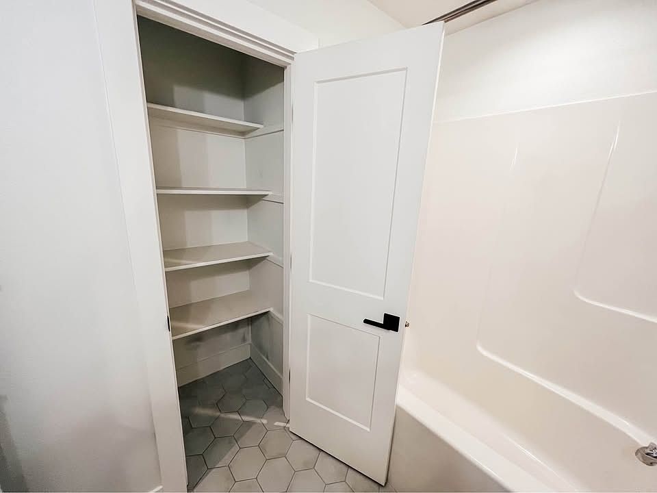 Convenient and spacious linen closet.