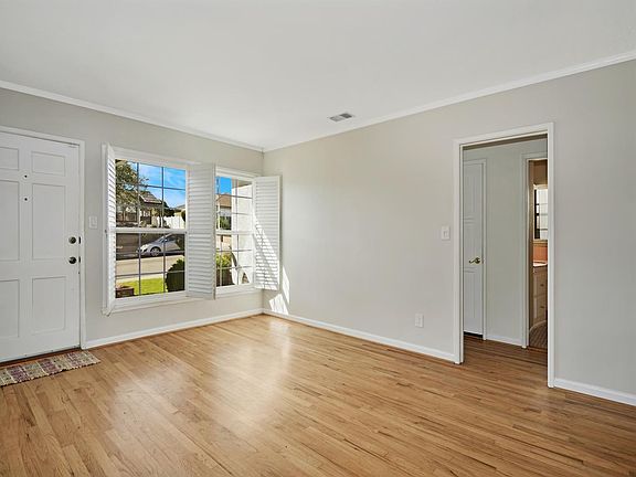 Entry off brick front porch.
