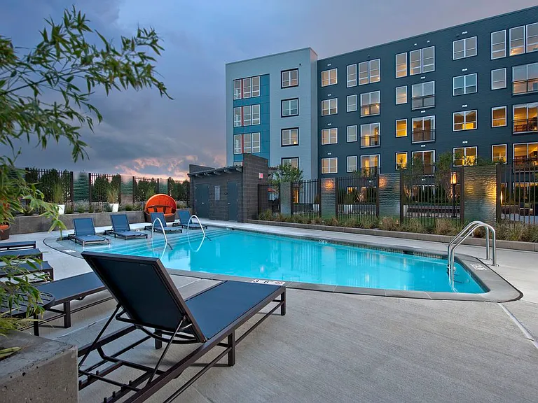 Swimming pool and sundeck with lounge seating