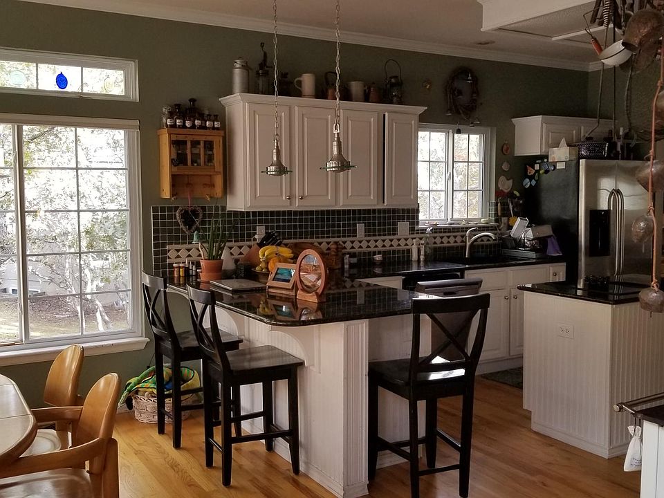 Beautiful kitchen with granite countertops and island with stove