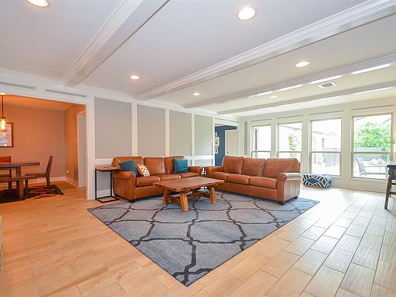 Easy care tile flooring extends throughout the downstairs. Natural light keeps this room bright and cheerful and provides a great view of the pool. Double pane windows have also been installed throughout.