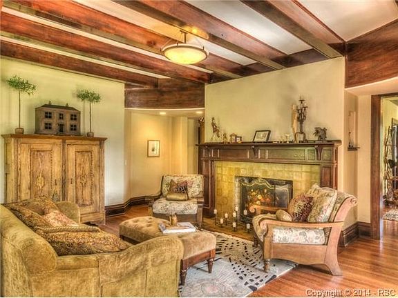 Living room with Van Briggle fireplace and beamed ceilings