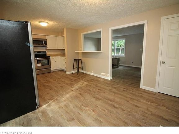 High breakfast bar with window into the living room!