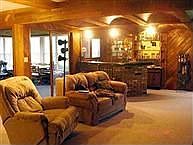 Family room w/ Bar opens to sun room.