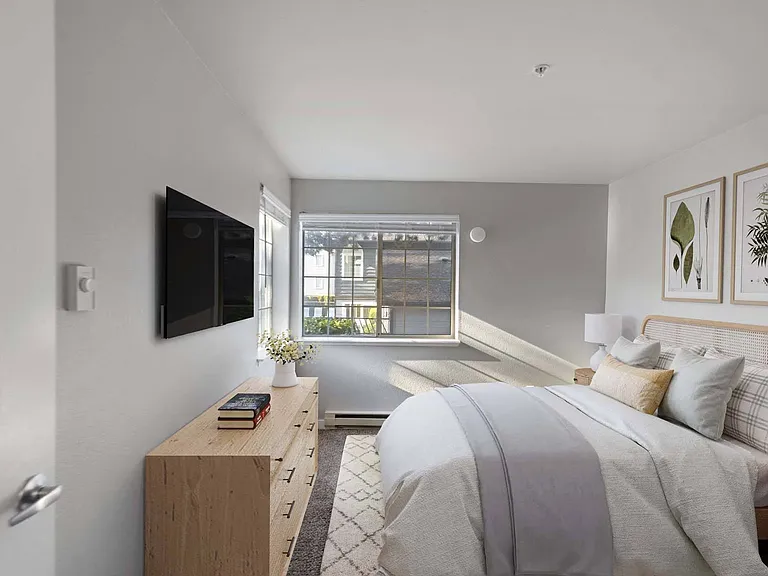 Unwind in this serene bedroom, designed for ultimate comfort and restful nights