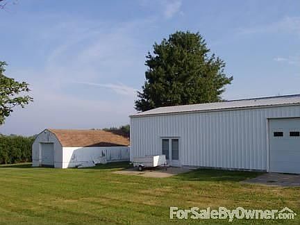 Far bldg ..storage. Closer bldg 24x50 heated w/220v