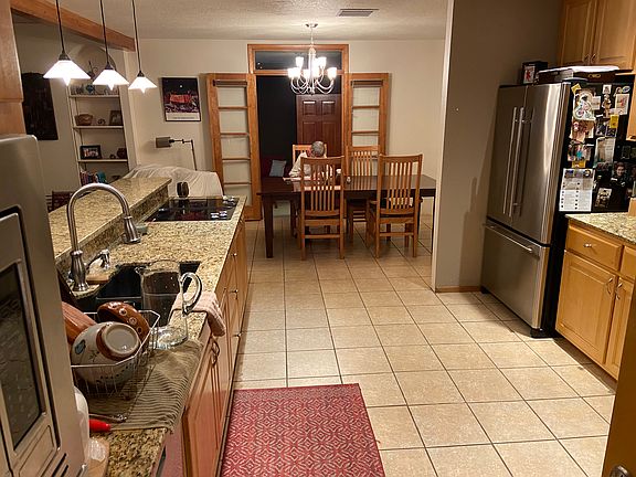 kitchen and dining area looking toward downstairs bedroom