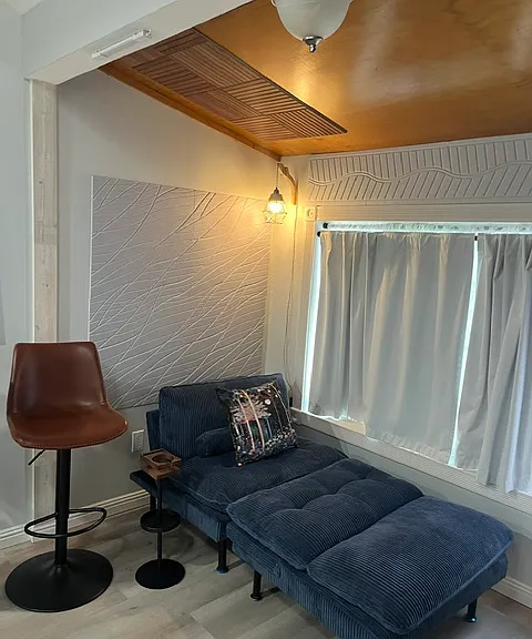 Cozy with hanging light for reading etc. also a small coffee table to hold a cup and cell phone.