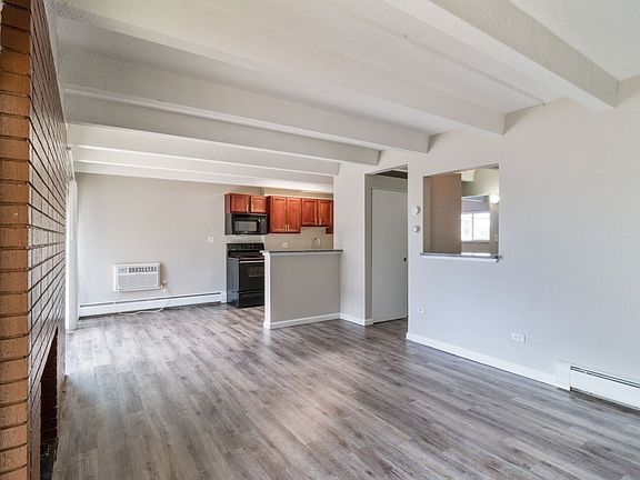 Bright living space with a fireplace and hardwood floors