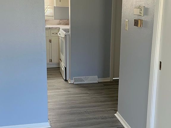 hallway between living room and kitchen