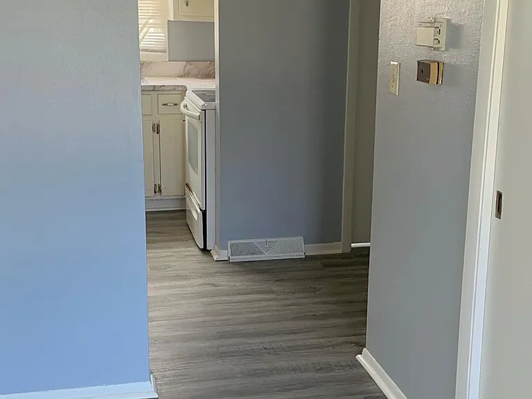 hallway between living room and kitchen