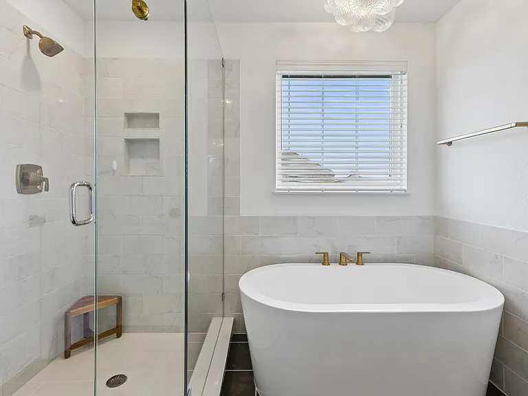 Primary Bathroom with double sinks, spacious shower and soaking tub.