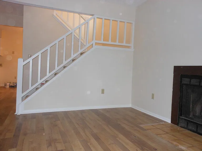 Front living room with central stairs
