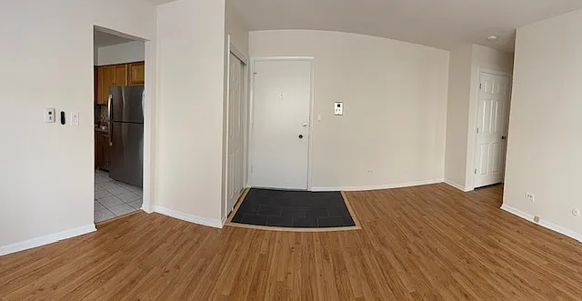 Livingroom (facing entry/front door, kitchen to the left, bathroom/bedroom to the right)
