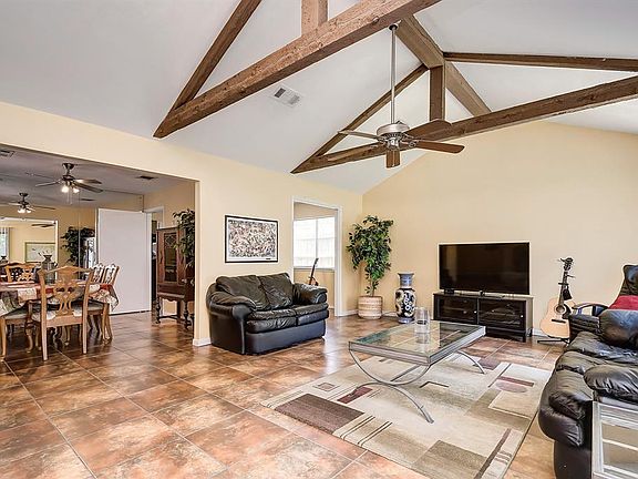 Another view of the living room shows the proximity to the dining room and breakfast area.