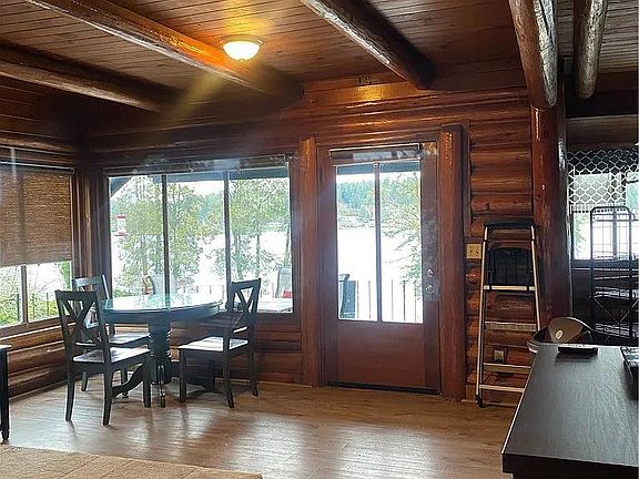 Large Living room with windows with sweeping view of the lake