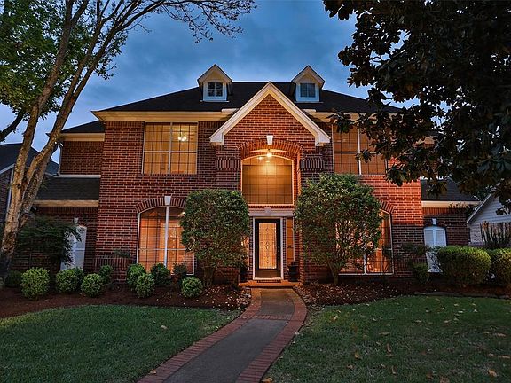 STATELY BRICK HOME WITH TWO CAR GARAGE