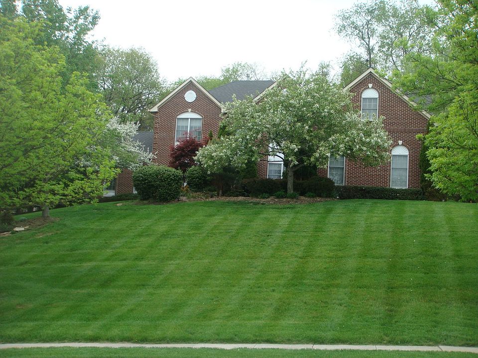 stately executive home on premium private one + acre lot
