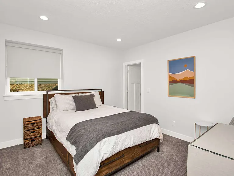 Bedroom with closet and queen bed.
Full Bathroom shared with adjacent room