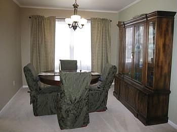 New crown molding and light fixtures, bring elegance to your entertaining in this formal dining room