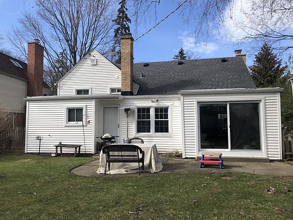 Rear View of the House Featuring a Spacious and Beautifully Fenced Backyard