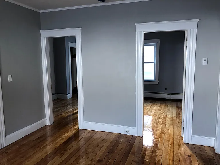Living room view to Bedroom #2 and Bedroom #3