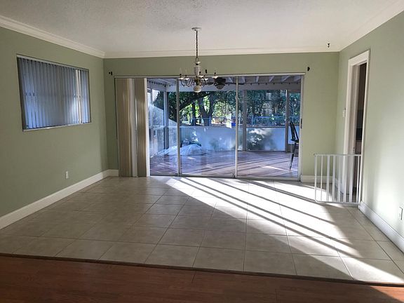 View from front room, looking at dining room and back patio.